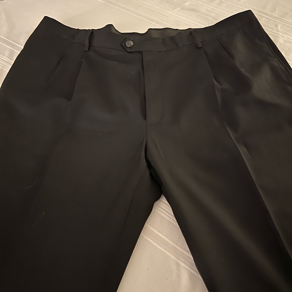 Practically new men’s black slacks by Hagar.